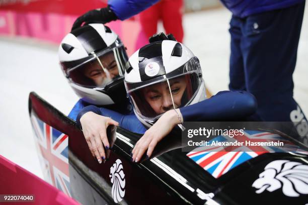 Mica Mcneill and Mica Moore of Great Britain react in the finish area during the Women's Bobsleigh heats on day twelve of the PyeongChang 2018 Winter...