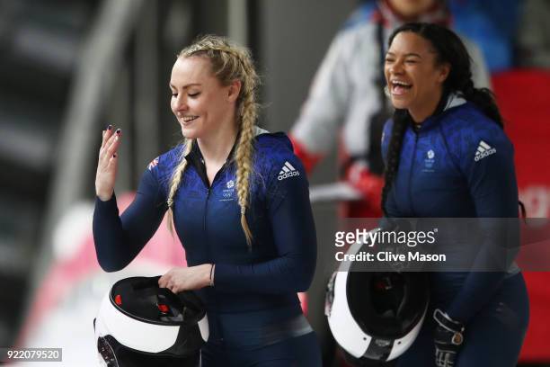 Mica Mcneill and Mica Moore of Great Britain react in the finish area during the Women's Bobsleigh heats on day twelve of the PyeongChang 2018 Winter...
