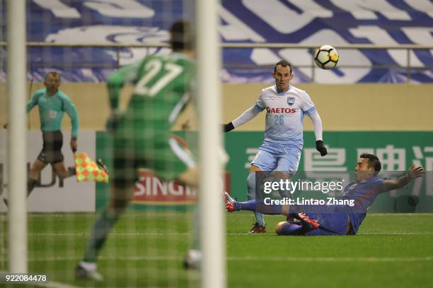 Luke Wilkshire of Sydney FC in action with Li Yunqiu of Shanghai Shenhua FC during the AFC Champions League Group H match between Shanghai Shenhua FC...