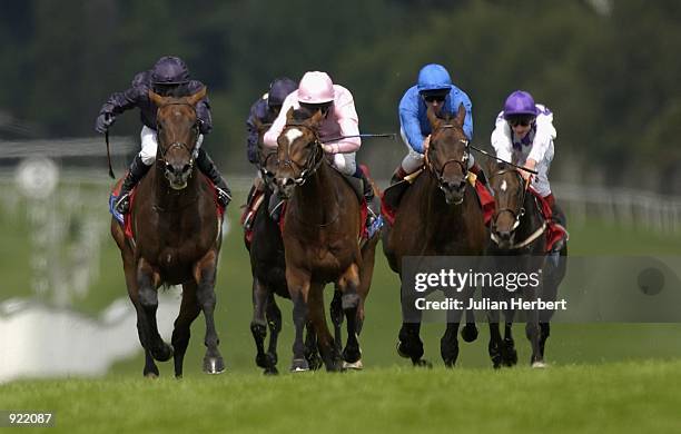 July 06: Mick Kinane and Hawk Wing lead the field home to land The Coral Eclipse Stakes run at Sandown Racecourse in Esher on July 06, 2002.