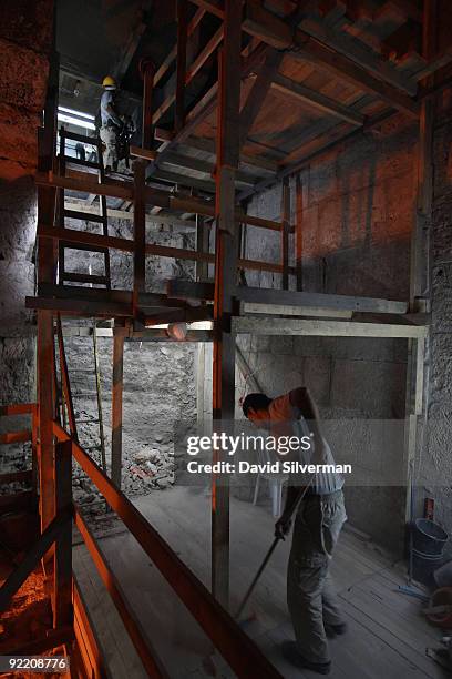 Palestinian employees of the Israeli Antiquity Authority work at the site of excavations in the Western Wall tunnels, on October 22, 2009 in...