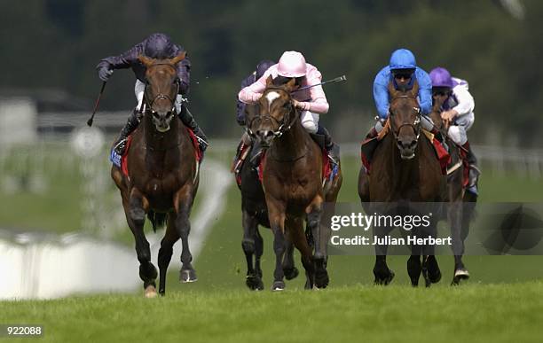 July 06: Mick Kinane and Hawk Wing lead the field home to land The Coral Eclipse Stakes run at Sandown Racecourse in Esher on July 06, 2002.