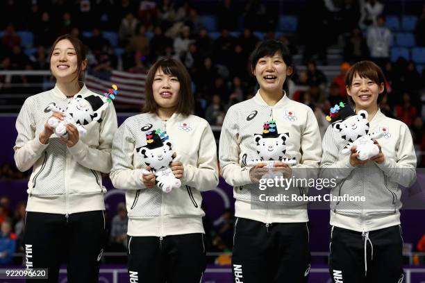 Gold medalists Miho Takagi, Ayaka Kikuchi, Ayano Sato and Nana Takagi of Japan celebrate during the victory ceremony after the Speed Skating Ladies'...