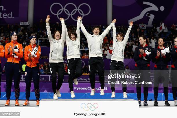 Gold medalists Miho Takagi, Ayaka Kikuchi, Ayano Sato and Nana Takagi of Japan celebrate during the victory ceremony after the Speed Skating Ladies'...