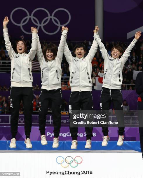 Gold medalists Miho Takagi, Ayaka Kikuchi, Ayano Sato and Nana Takagi of Japan celebrate during the victory ceremony after the Speed Skating Ladies'...