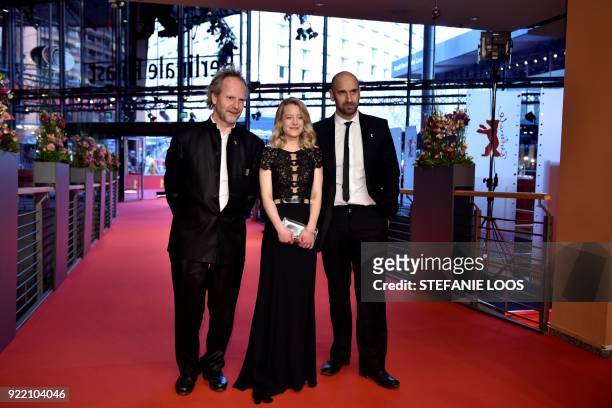 German director Philip Groening, German actress Julia Zange and Swiss actor Urs Jucker pose on the red carpet before the premiere of the film "My...