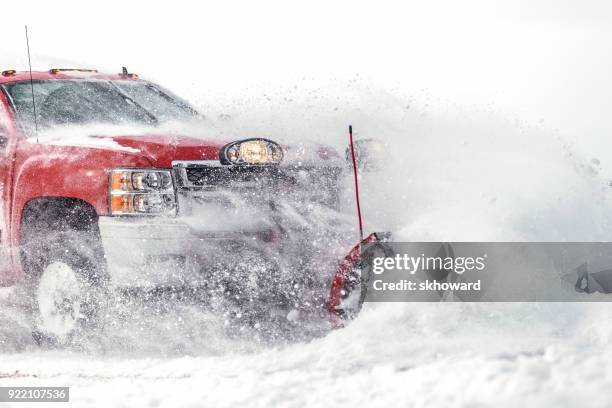 chevrolet pick-up truck plowing fresh snow - plowing stock pictures, royalty-free photos & images