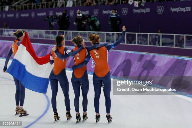 Ireen Wust, Marrit Leenstra, Lotte Van Beek and Antoinette De Jong of the Netherlands react after being defeated by Japan in the gold medal race...