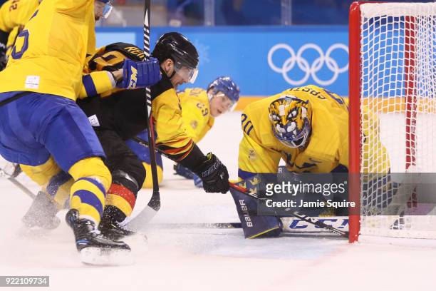 Patrick Reimer of Germany scores a goal against Viktor Fasth of Sweden in overtime to win 4-3 during the Men's Play-offs Quarterfinals game on day...