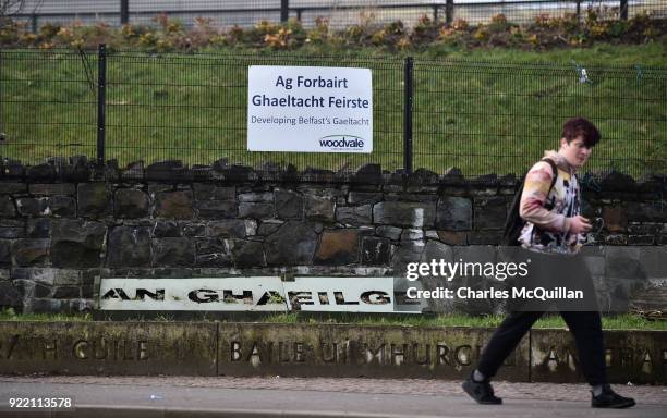 Man walks past a school which promotes Irish language in west Belfast on February 21, 2018 in Belfast, Northern Ireland. Talks to restore the...