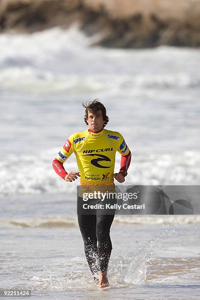 David Luis of Portugal runs along the shoreline as a warmup before his Round 1 heat of the Rip Curl Pro Search on October 22, 2009 in Peniche,...