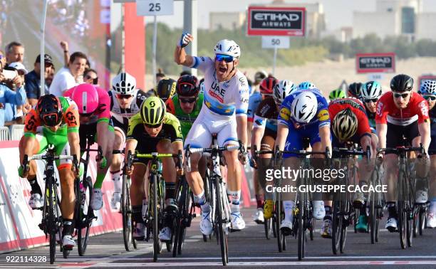 WorldTeam UAE Team Emirates' Norwegian cyclist Alexander Kristoff celebrates as he crosses the finish line during the first stage of the 2018 Abu...
