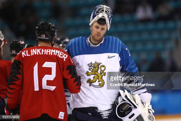 Mikko Koskinen of Finland shakes hands with Rob Klinkhammer of Canada after the Men's Play-offs Quarterfinals on day twelve of the PyeongChang 2018...