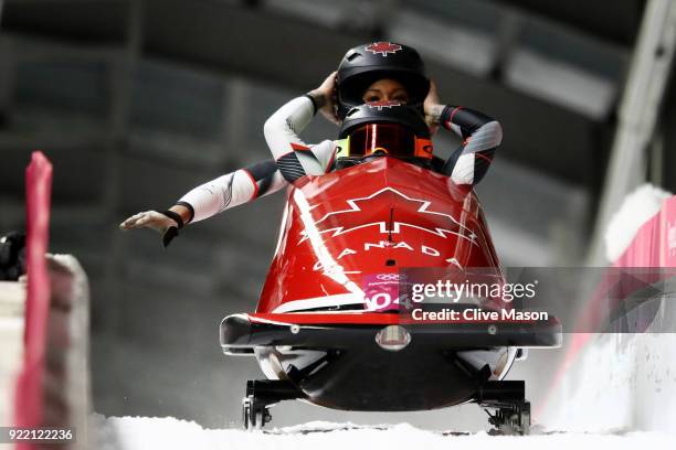 Kaillie Humphries and Phylicia George of Canada react in the finish area during the Women's Bobsleigh heats on day twelve of the PyeongChang 2018...