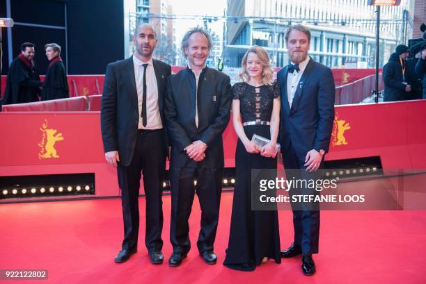 Swiss actor Urs Jucker, German director Philip Groening, German actress Julia Zange and German actor Stefan Konarske pose on the red carpet before...