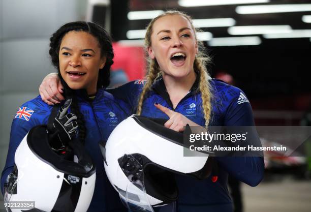 Mica Mcneill and Mica Moore of Great Britain react in the finish area during the Women's Bobsleigh heats on day twelve of the PyeongChang 2018 Winter...