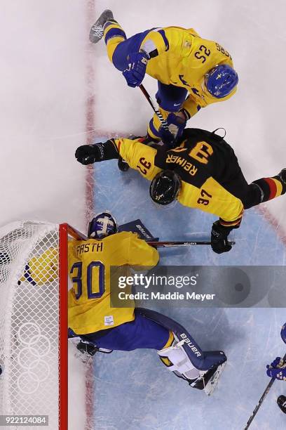 Patrick Reimer of Germany scores a goal on Viktor Fasth of Sweden in overtime to win 4-3 during the Men's Play-offs Quarterfinals game on day twelve...