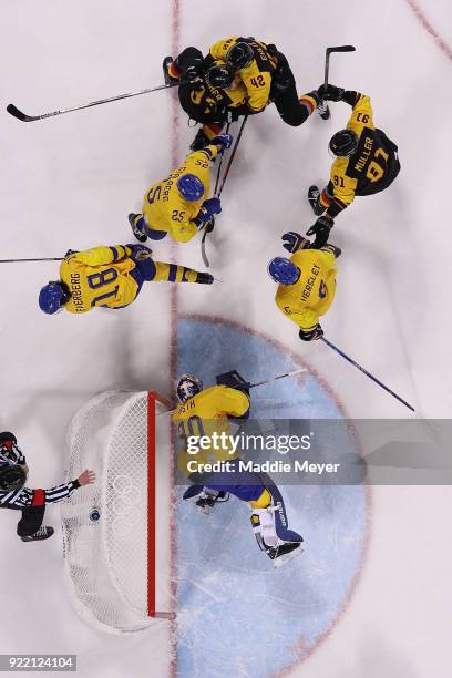 Patrick Reimer of Germany scores a goal on Viktor Fasth of Sweden in overtime to win 4-3 during the Men's Play-offs Quarterfinals game on day twelve...