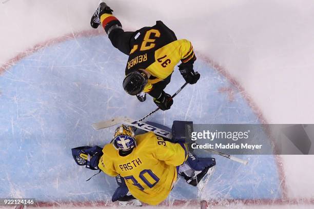 Patrick Reimer of Germany scores a goal on Viktor Fasth of Sweden in overtime to win 4-3 during the Men's Play-offs Quarterfinals game on day twelve...