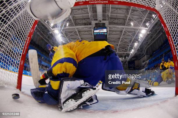 Patrick Reimer of Germany scores a goal against Viktor Fasth of Sweden in overtime to win 4-3 during the Women's Ice Hockey Bronze Medal game on day...