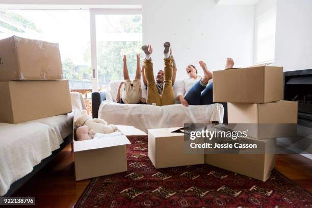 a young family celebrate moving into a new home - photohui17 bildbanksfoton och bilder