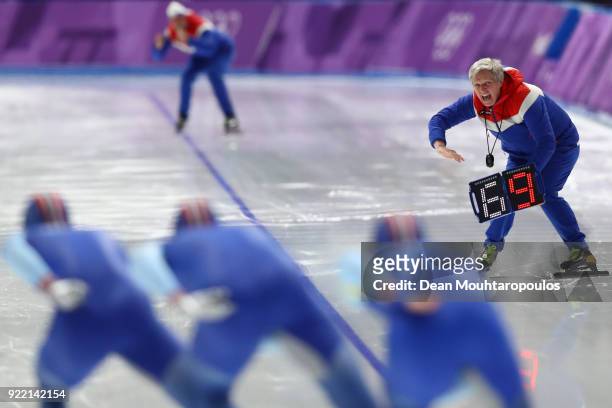 Sverre Lunde Pedersen, Havard Bokko and Simen Spieler Nilsen of Norway compete as a coach gives instruction during the Speed Skating Men's Team...