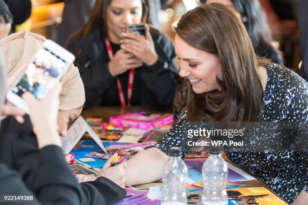 Catherine, Duchess of Cambridge gets a henna tattoo during a visit to The Fire Station, one of Sunderland's most iconic buildings, recently converted...