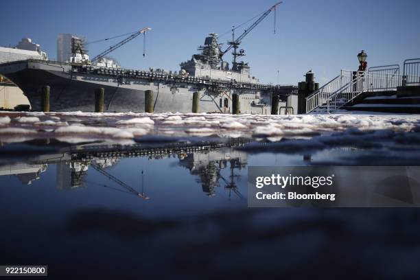 The USS Bataan Wasp-class amphibious assault ship sits docked at the BAE Systems Plc Norfolk Ship Repair facility on the Elizabeth River in Norfolk,...