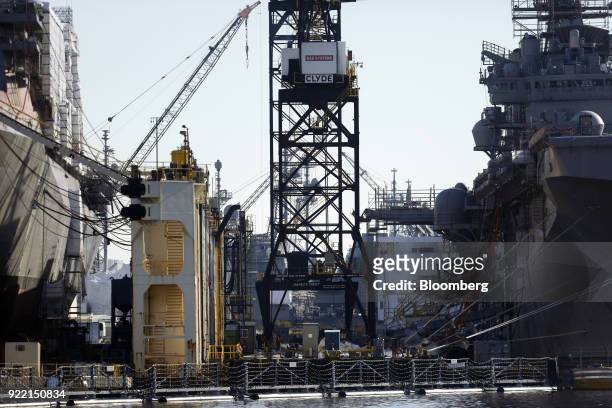 Construction cranes stand at the BAE Systems Plc Norfolk Ship Repair facility on the Elizabeth River in Norfolk, Virginia, U.S., on Tuesday, Jan. 9,...