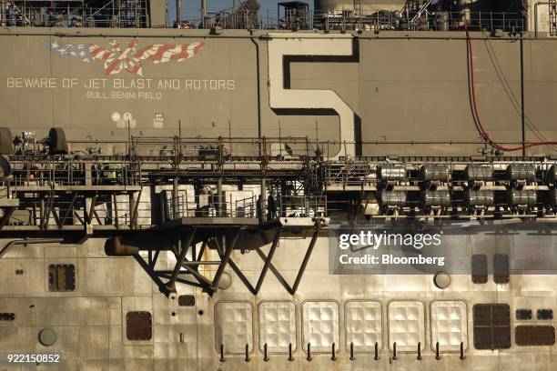 The USS Bataan Wasp-class amphibious assault ship sits docked at the BAE Systems Plc Norfolk Ship Repair facility on the Elizabeth River in Norfolk,...