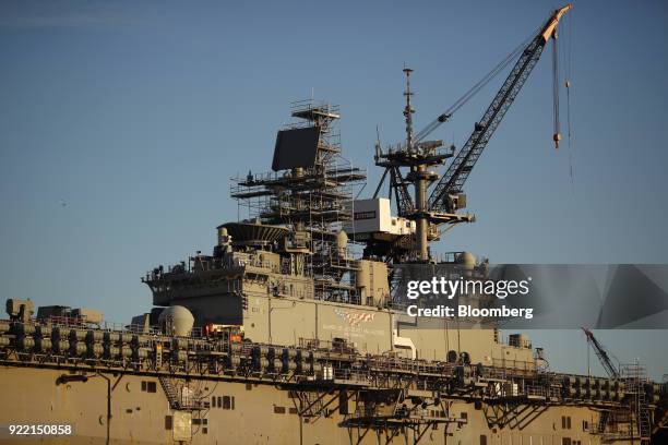 The USS Bataan Wasp-class amphibious assault ship sits docked at the BAE Systems Plc Norfolk Ship Repair facility on the Elizabeth River in Norfolk,...