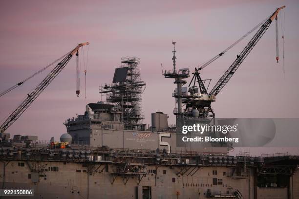 The USS Bataan Wasp-class amphibious assault ship sits docked at the BAE Systems Plc Norfolk Ship Repair facility on the Elizabeth River in Norfolk,...