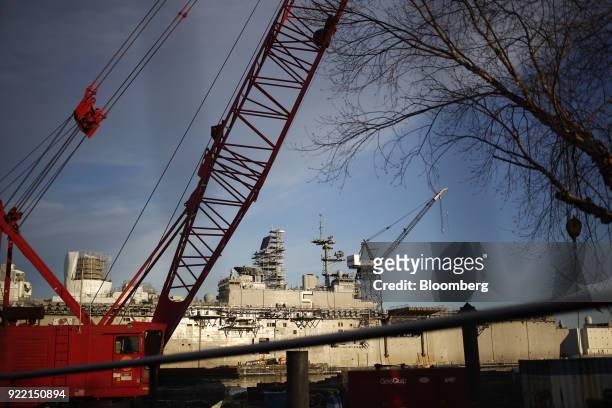 The USS Bataan Wasp-class amphibious assault ship sits docked at the BAE Systems Plc Norfolk Ship Repair facility on the Elizabeth River in Norfolk,...