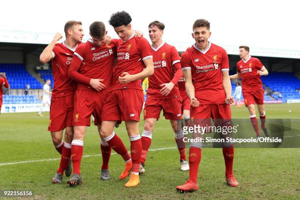 Ben Woodburn of Liverpool celebrates with teammates after scoring their 1st goal during the UEFA Youth League Round of 16 match between Liverpool and...