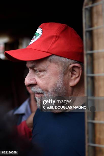 Former president of Brazil, Luiz Inacio Lula da Silva chats with members of the Landless Workers Movement at their camp on the municipality of...