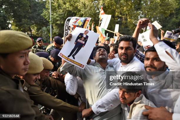 Indian Youth Congress activists and workers scuffle with police during a protest march against Finance Minister Arun Jaitley and Punjab National Bank...