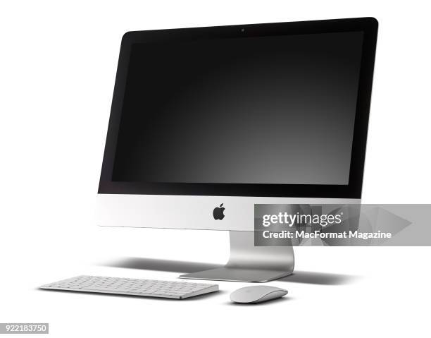 Inch Apple iMac with Retina 4K display alongside a wireless Apple Magic Keyboard and Magic Mouse 2, taken on June 23, 2017.