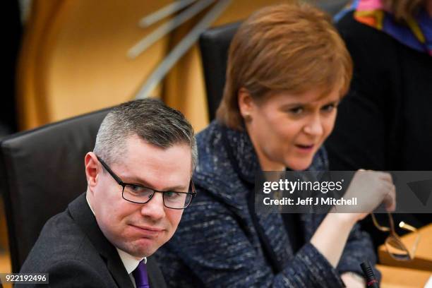 Finance secretary Derek Mackay, First Minister of Scotland Nicola Sturgeon react in the Scottish Parliament during final stage of Scottish Budget on...