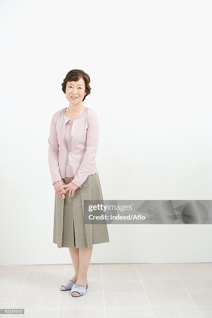 Japanese woman standing in a room