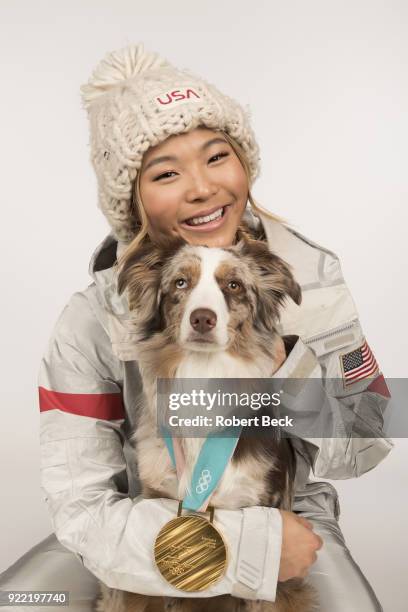 Portrait of USA Chloe Kim posing with her Australian shepherd dog Reese and gold medal during photo shoot at Los Coyotes Country Club. Kim won gold...