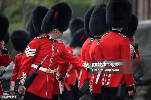 Soldiers from the 1st Battalion Coldstream Guards make last minute adjustments before they take part in the annual Major General's Inspection at...