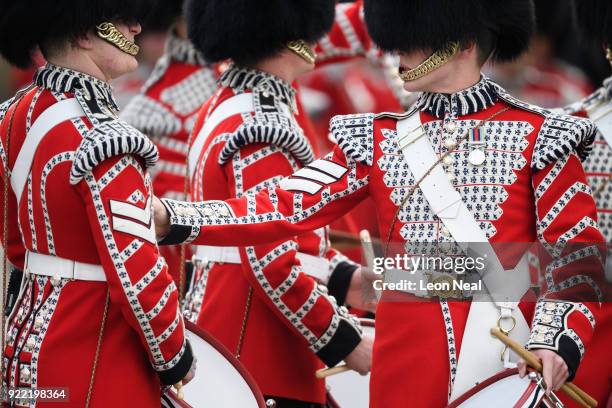 Members of the Drum Corp of the Coldstream Guards make last minute adjustments before they take part in the annual Major General's Inspection at...