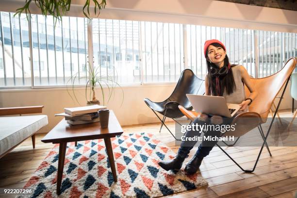 young female start up business woman talking with colleague in office - michael sit stock pictures, royalty-free photos & images