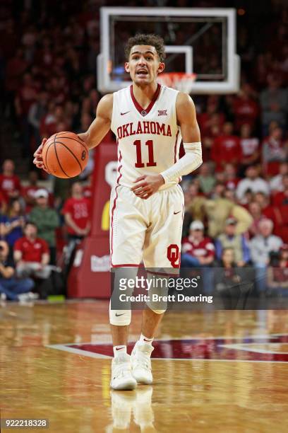 Trae Young of the Oklahoma Sooners dribbles down court during the game against the Texas Longhorns at Lloyd Noble Center on February 24, 2018 in...