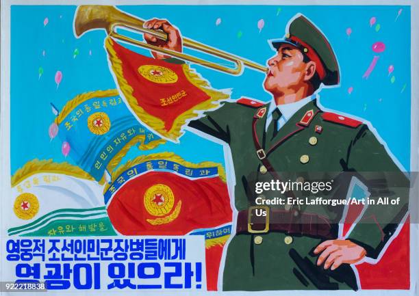 North Korean propaganda poster depicting a soldier blowing in a horn, Pyongan Province, Pyongyang, North Korea on December 6, 2017 in Pyongyang,...