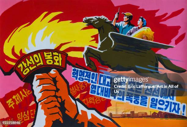 North Korean propaganda poster depicting the Chollima horse and the Juche tower flame, Pyongan Province, Pyongyang, North Korea on December 6, 2017...