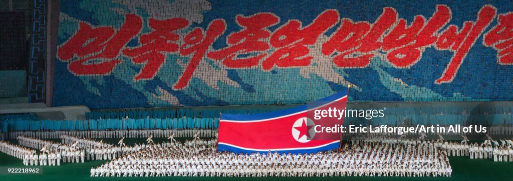 North Korean taekwondo team in front of a giant flag during the Arirang mass games in may day stadium, Pyongan Province, Pyongyang, North Korea...