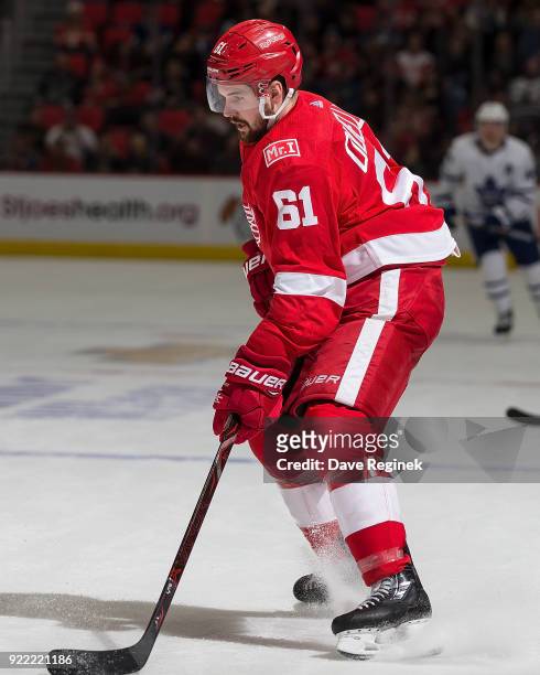 Xavier Ouellet of the Detroit Red Wings controls the puck against the Toronto Maple Leafs during an NHL game at Little Caesars Arena on February 18,...