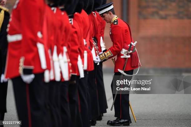 Adjustments are made to a Coldstream Guard soldier's uniform as they they take part in the annual Major General's Inspection at Victoria barracks on...
