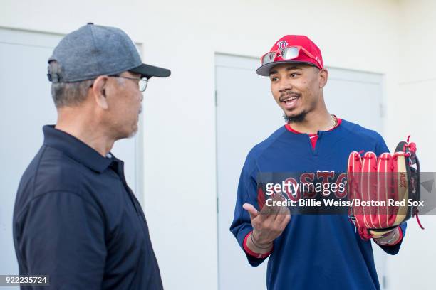 Mookie Betts of the Boston Red Sox holds a Wilson glove during a team workout on February 21, 2018 at jetBlue Park at Fenway South in Fort Myers,...